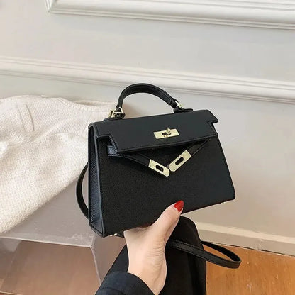 Sac bandoulière femme avec poignée rigide