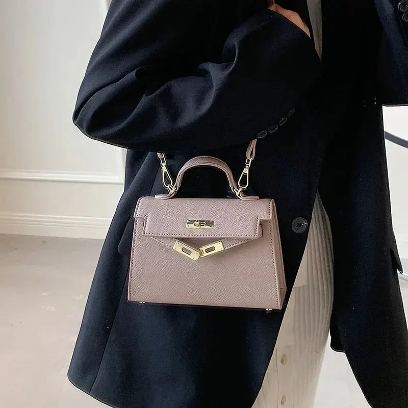 Sac bandoulière femme avec poignée rigide