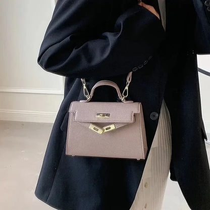 Sac bandoulière femme avec poignée rigide