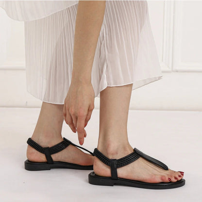 Sandales plates pour femme, finition tressée