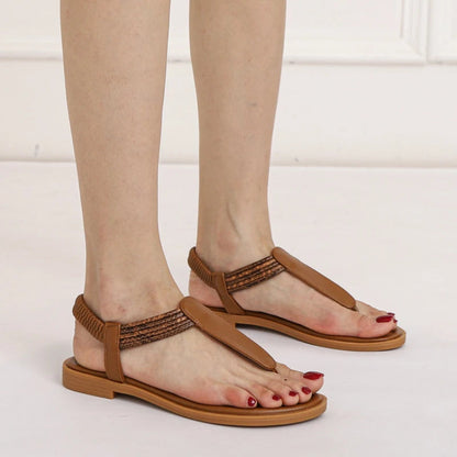 Sandales plates pour femme, finition tressée